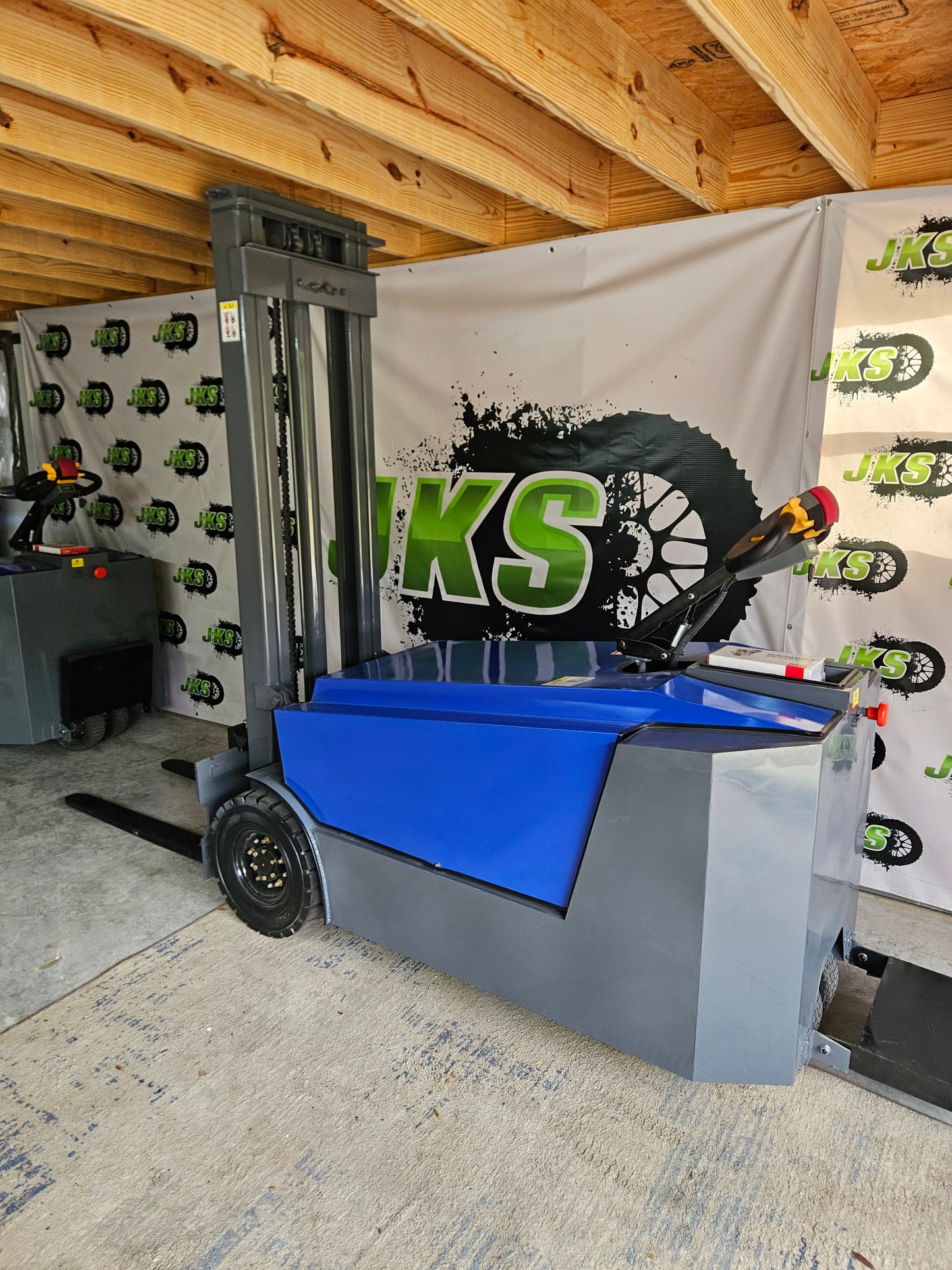 JKS All-Terrain E15 Stand Up Forklift "Big Blue"