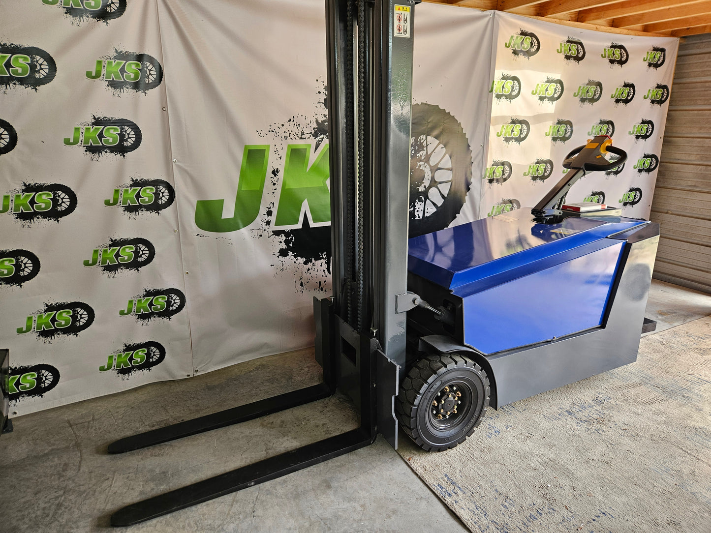 JKS All-Terrain E15 Stand Up Forklift "Big Blue"