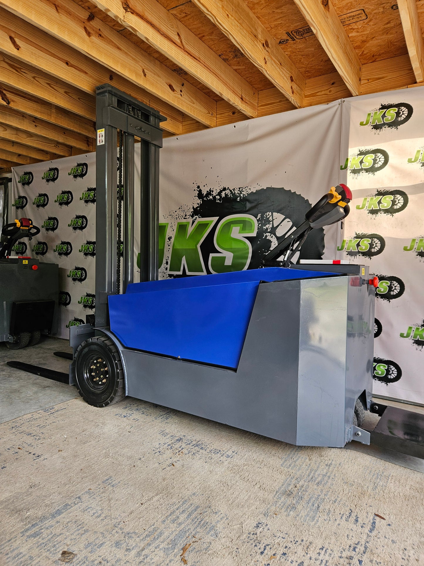 JKS All-Terrain E15 Stand Up Forklift "Big Blue"