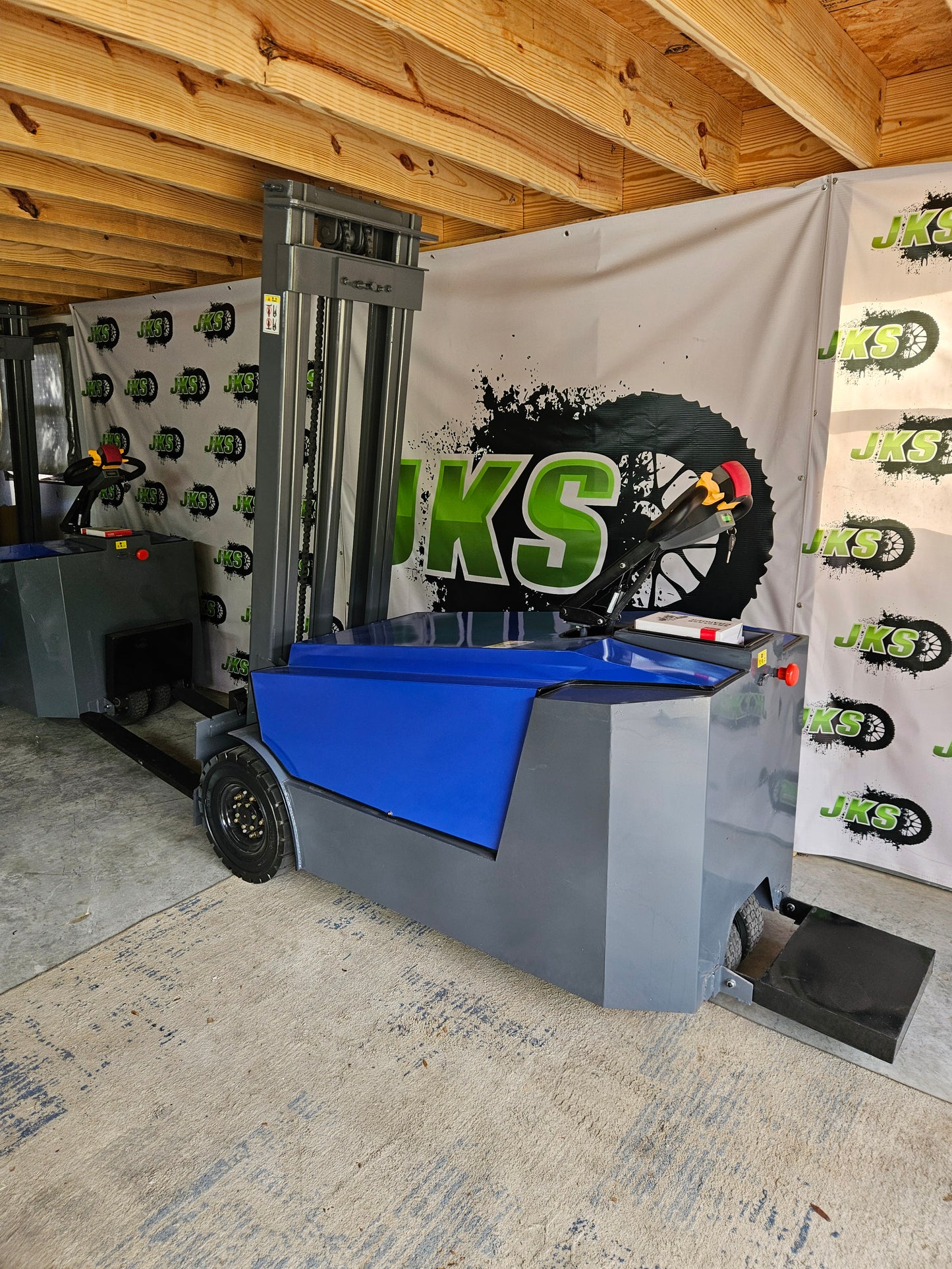 JKS All-Terrain E15 Stand Up Forklift "Big Blue"